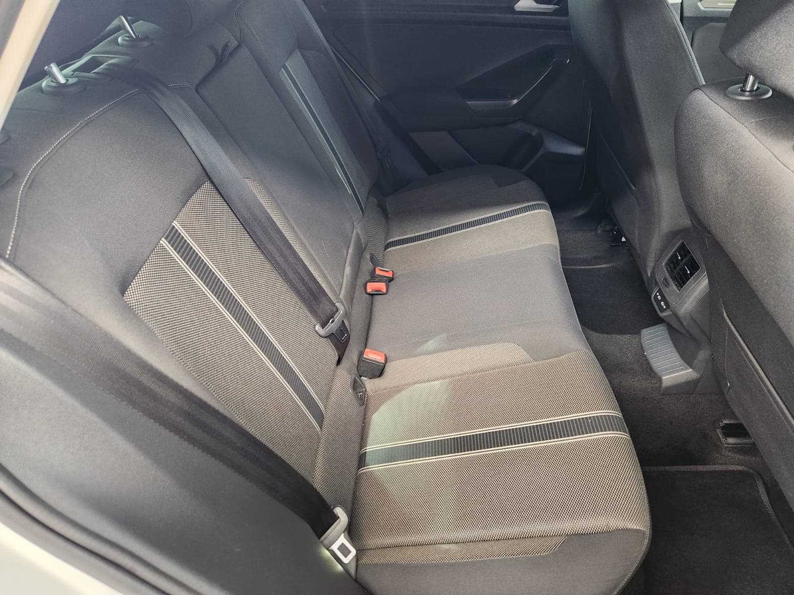 Rear passenger seats with grey fabric upholstery inside a 2021 Volkswagen T-Roc 1.4 TSI Design Auto.